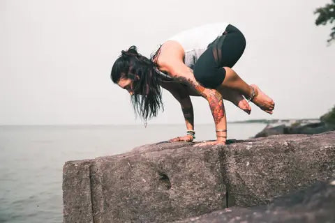 A woman exercises to treat ecezema with yoga.