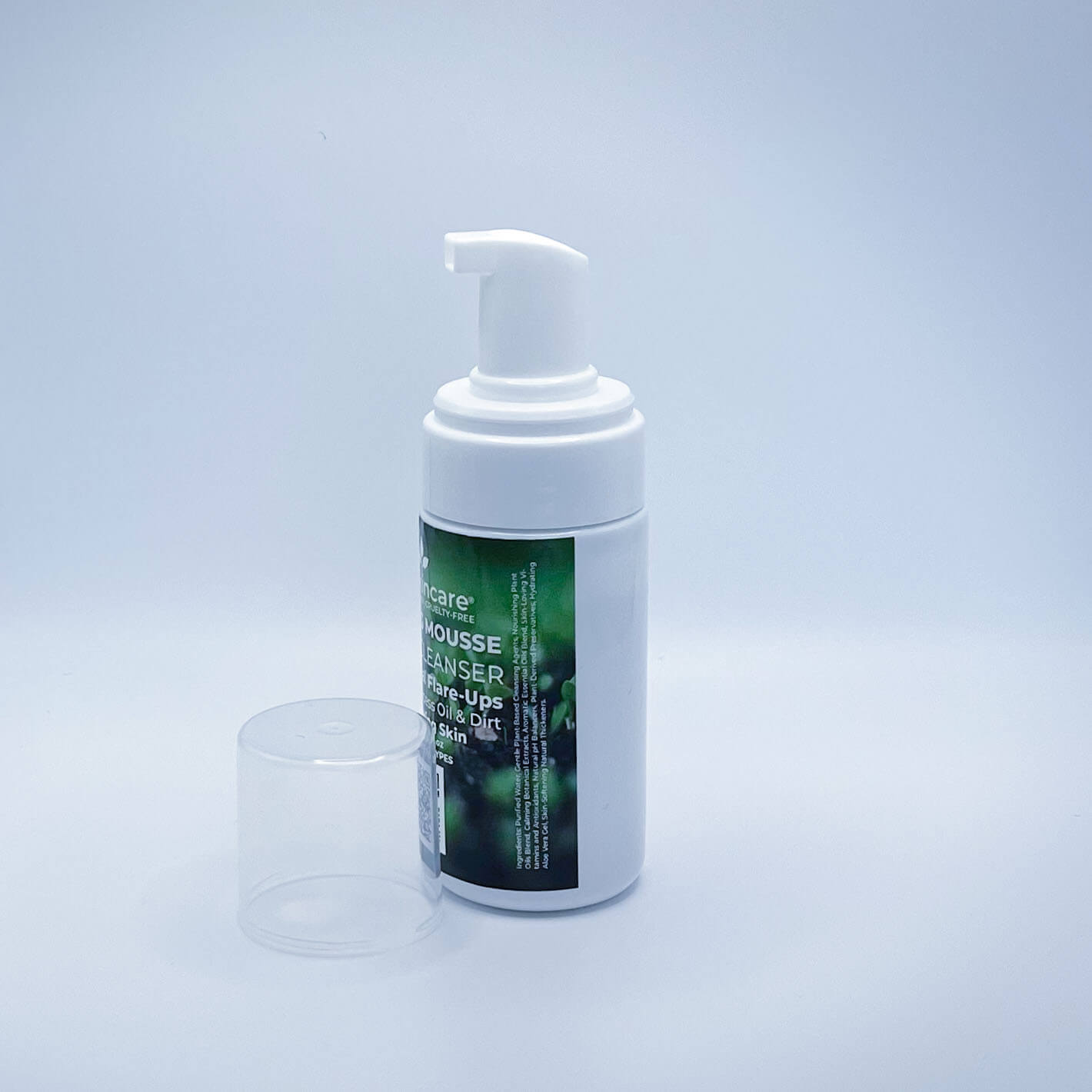 Fate Skincare's Foaming Mousse Facial Cleanser in a 3.3 ounce white pump bottle with a clear top, showcasing Fate Skincare's iconic logo with a tree sprouting out of the 'I', symbolizing the brand's connection to nature.