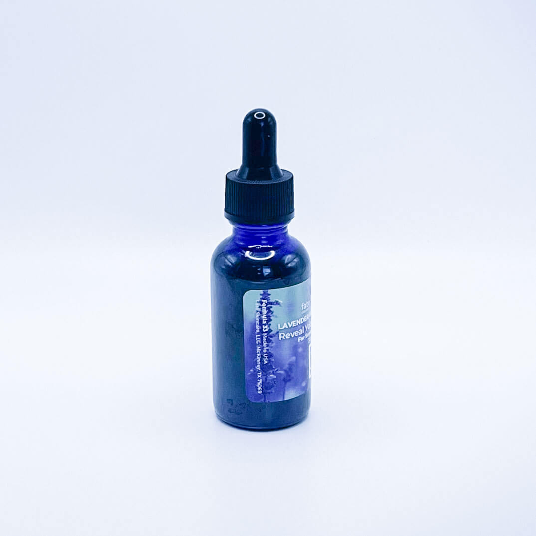 Fate Skincare's Lavender Rose Bliss Face Serum in a blue glass bottle with a black dropper, showcasing Fate Skincare's iconic logo on a subtle green nature-inspired background.